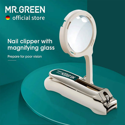 MR.GREEN nail clipper with 2x magnifying glass and anti-splash catcher on teal, safe trimming for low-vision users.