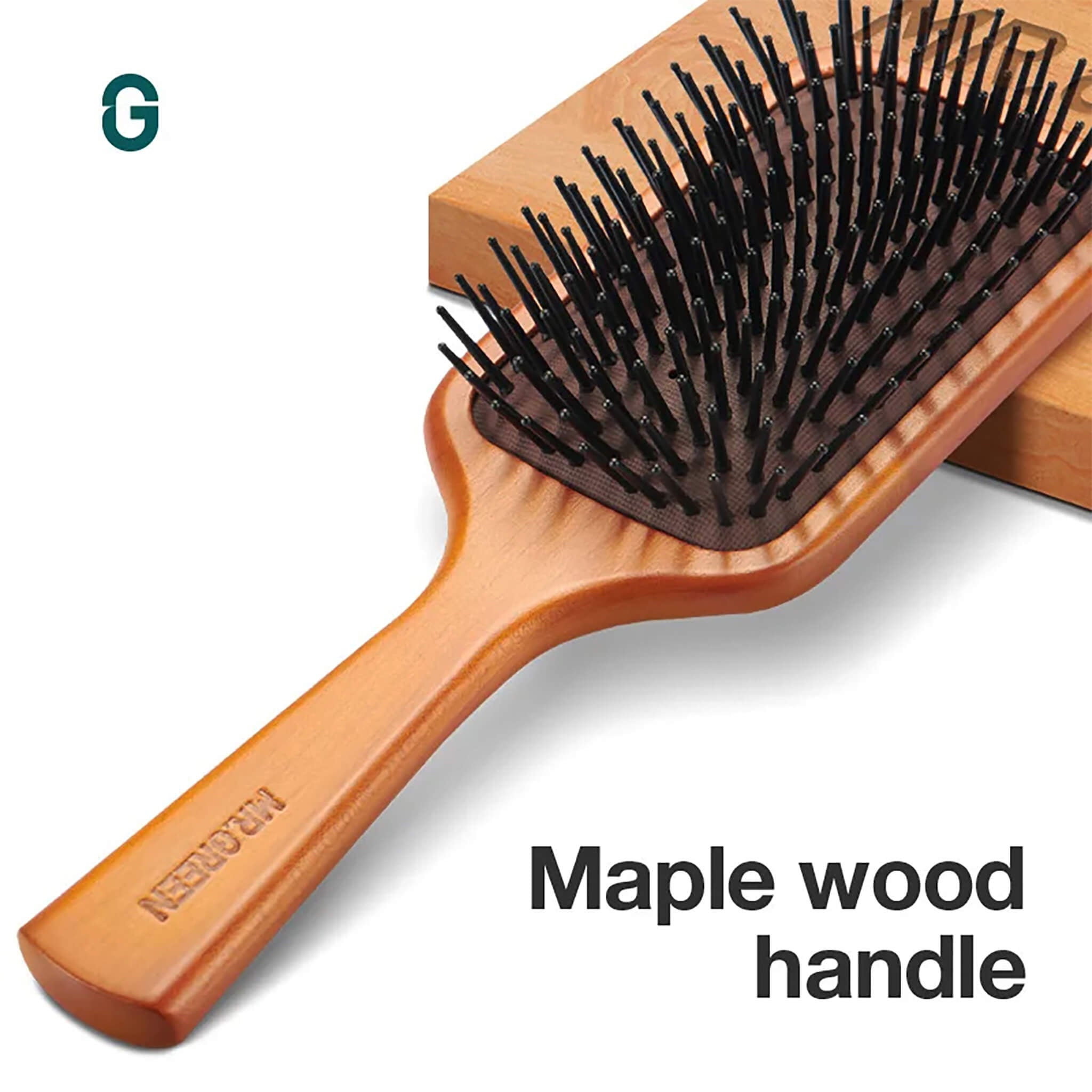 MR.GREEN maple wood handle paddle brush with ergonomic grip and cushioned pins for frizz-free brushing and scalp comfort.