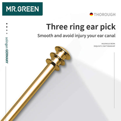 Limpiador de oídos MR.GREEN de triple anillo en acero inoxidable dorado para limpieza 360° suave y controlada; detalle macro.