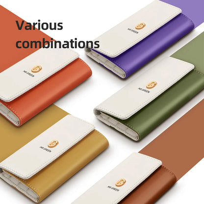 Mehrere bicolore MR.GREEN Wallet-Etuis in Orange, Lila, Grün, Ocker und Braun – farbige Optionen für das Maniküre-Set.